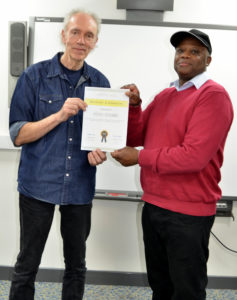 Author Phil Page awarding a Certificate of Completion